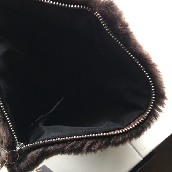 A brown furry bag with tags from indigo - Picture 2 of 4